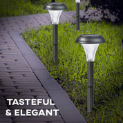 Solar garden lights on grass next to a pathway with text 'Tasteful & Elegant'.