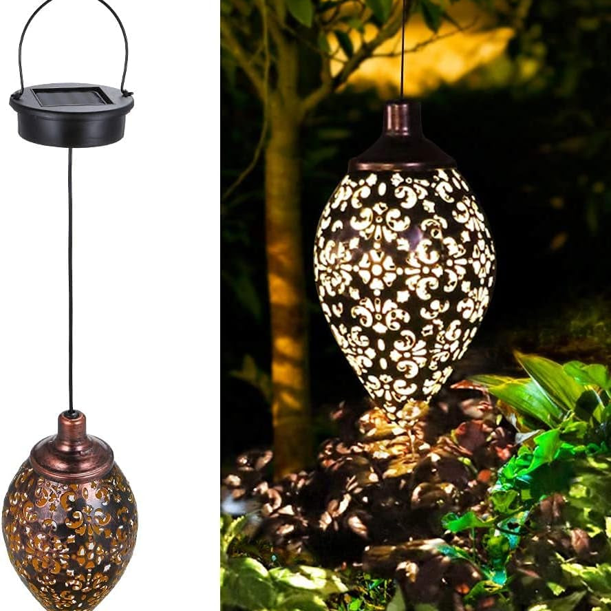 Solar hanging light with intricate design, shown in two views: on a white background and illuminated in a garden setting.