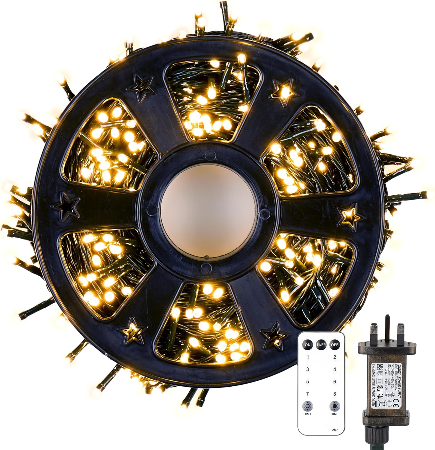 Spool of LED string lights with remote control on a white background