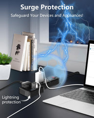 Surge protector with lightning effect on a desk with books and a laptop.