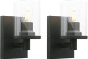 Two black wall sconces with glass shades on a white background