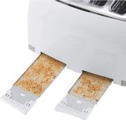 Two slices of bread with grill marks coming out of a toaster.
