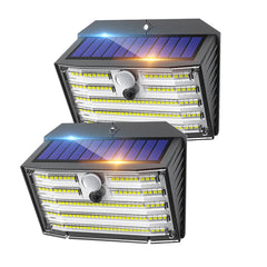 Two solar-powered outdoor lights with visible solar panels on a white background