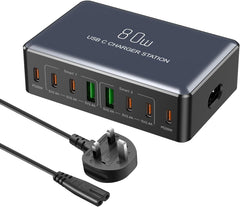 USB C charger station with multiple ports and a power cord on a white background