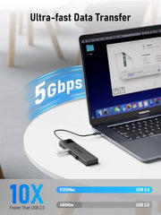 USB adapter with laptop displaying data transfer speed on a white background