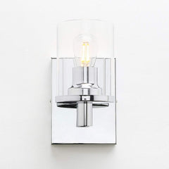 Wall-mounted light fixture with clear glass shade on a white background
