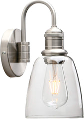 Wall-mounted light fixture with clear glass shade and metallic finish on a white background