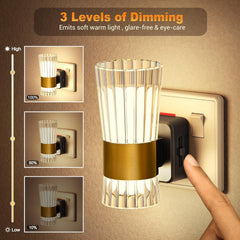 Wall-mounted light fixture with dimming control on a brown background