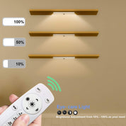 Wall-mounted light fixture with remote control for brightness adjustment on a beige wall.