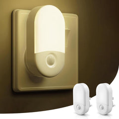 Wall-mounted night light with two additional light bulbs on a dark background