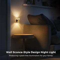 Wall sconce-style design night light in a dimly lit room with a sofa and table.