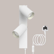 White ceiling light fixture with plug and socket on a beige background