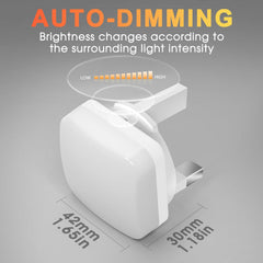 White electronic device with auto-dimming feature on a gray background
