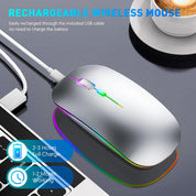 Wireless mouse with colorful LED lights on a gray surface, surrounded by a laptop and smartphone.