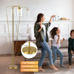 Woman and children playing in a living room with a gold floor lamp.